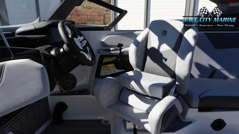 Slide: The Image of 2024 Nautique GS24 boat interior with Race City Marine branding. - 33