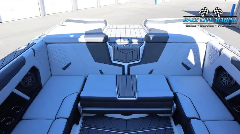 Slide: The Image of 2024 Nautique GS24 boat interior with luxurious seating and modern design. - 37
