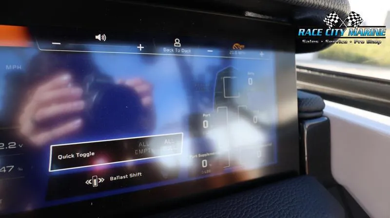 Slide: The Image of 2024 Nautique GS24 touchscreen control panel at Race City Marine. - 38