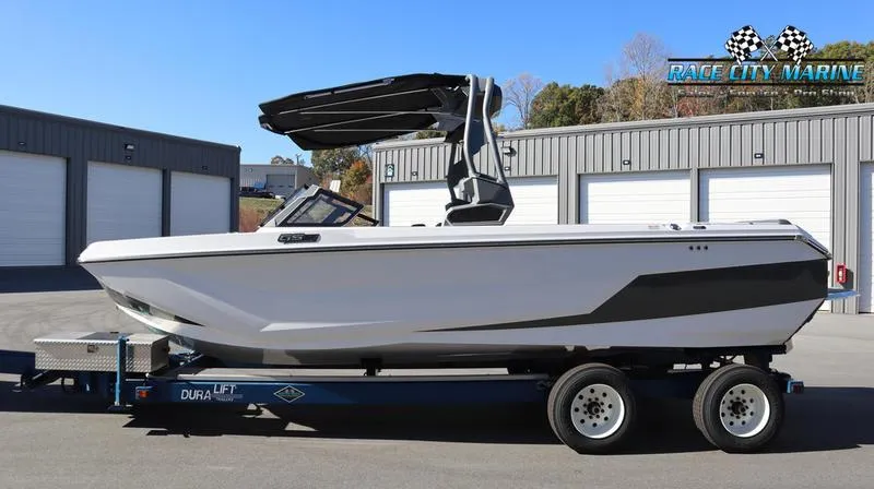 Slide: The Image of 2024 Nautique GS24 boat on a trailer at Race City Marine dealership. - 9