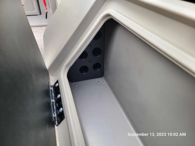 Slide: The Image of Storage compartment of 2024 Sun Tracker SportFish 22 DLX pontoon boat. - 12