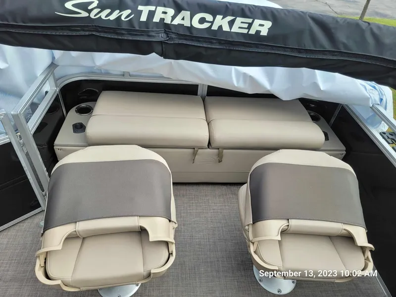 Slide: The Image of 2024 Sun Tracker SportFish 22 DLX boat interior with seating and storage. - 19
