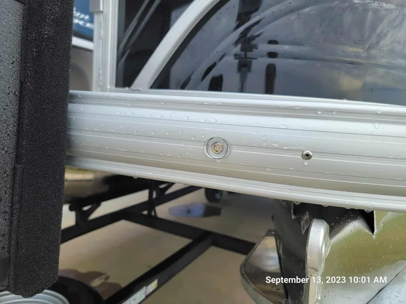 Slide: The Image of Close-up of 2024 Sun Tracker SportFish 22 DLX boat frame with water droplets. - 9