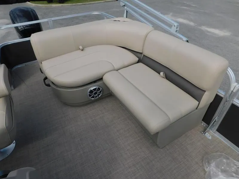 Slide: The Image of Sun Tracker Party Barge 18 DLX 2024 interior seating with beige upholstery. - 11