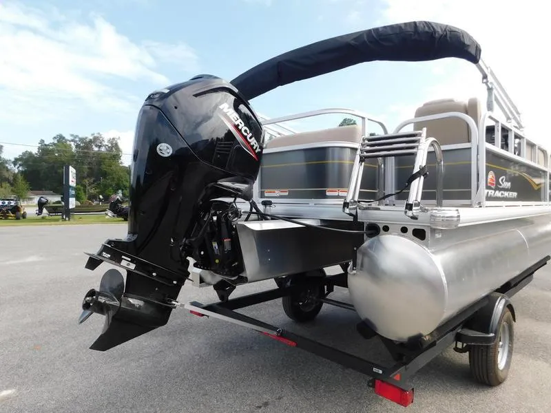 Slide: The Image of 2024 Sun Tracker Party Barge 18 DLX pontoon boat with Mercury outboard motor. - 4