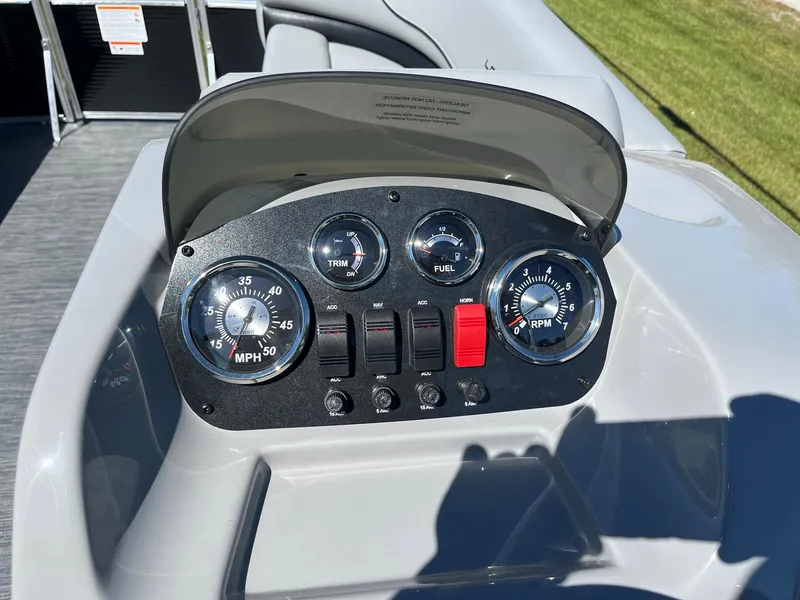 Slide: The Image of Dashboard of 2024 Lowe Ultra 160 Cruise boat with gauges and controls. - 10