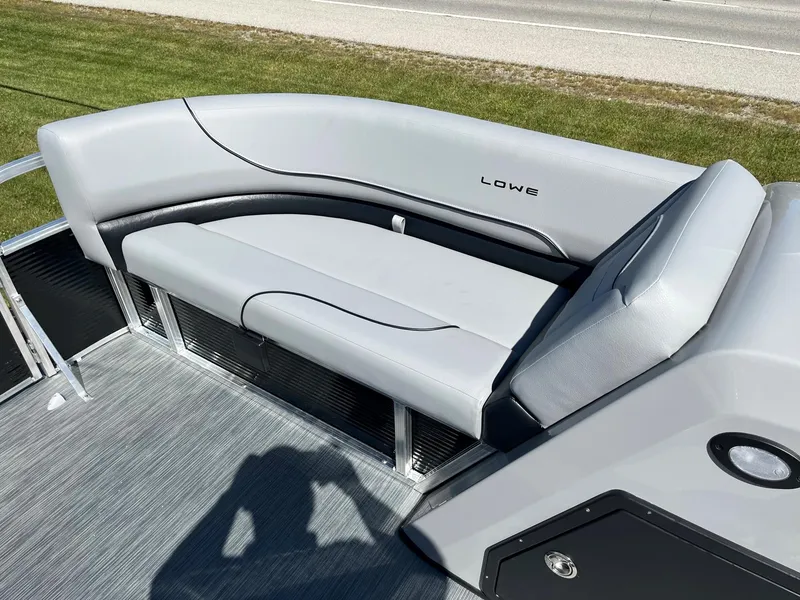 Slide: The Image of 2024 Lowe Ultra 160 Cruise boat with gray seating and modern design. - 12