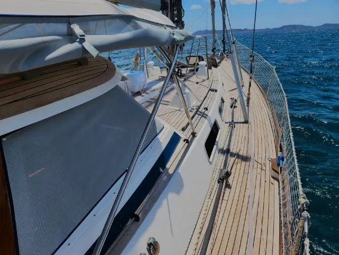 Slide: The Image of Sailing yacht Hallberg-Rassy 53, 2006 model, cruising on open sea with clear skies. - 27