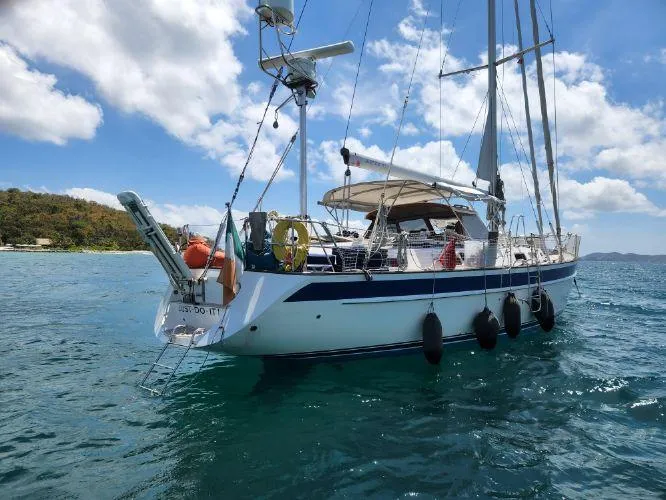 Slide: The Image of Sailing yacht Hallberg-Rassy 53, 2006 model, anchored in clear blue waters. - 32