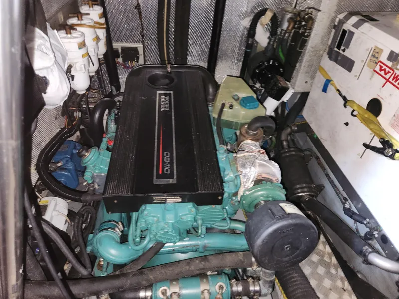 Slide: The Image of Engine room of a 2006 Hallberg-Rassy 53 yacht, featuring a Volvo Penta engine. - 34