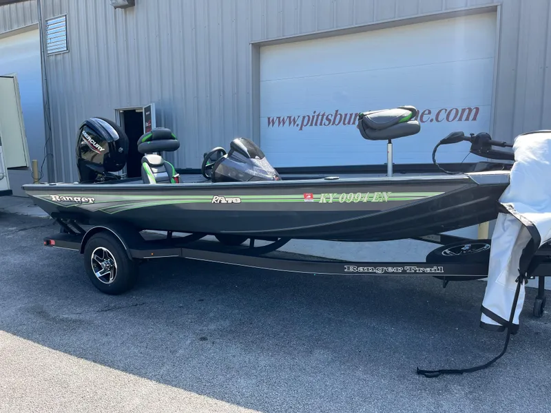 Slide: The Image of 2024 Ranger RT178 fishing boat on trailer outside a building. - 1