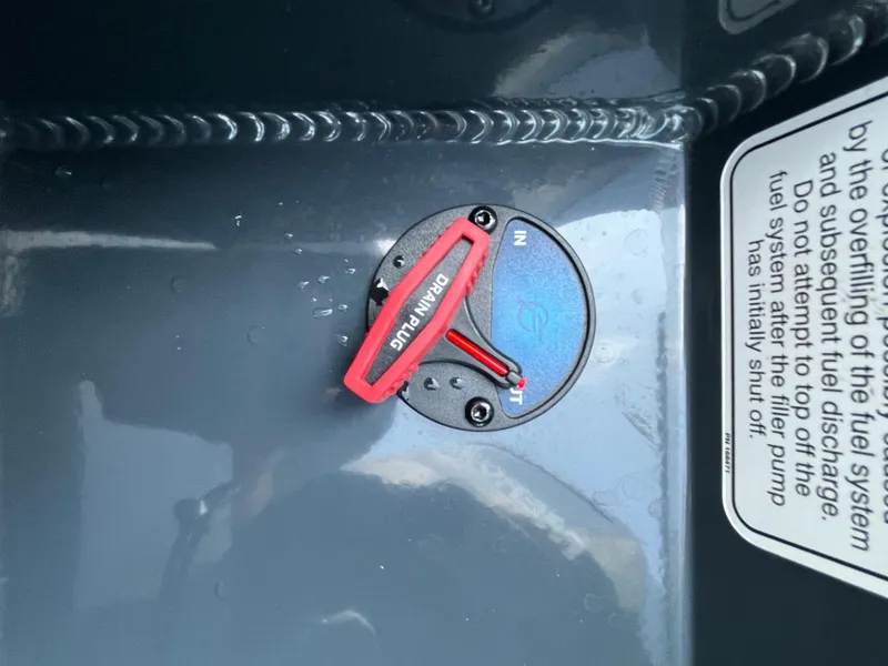 Slide: The Image of Fuel system component of 2024 Ranger RT178 boat with red lever and instruction label. - 11