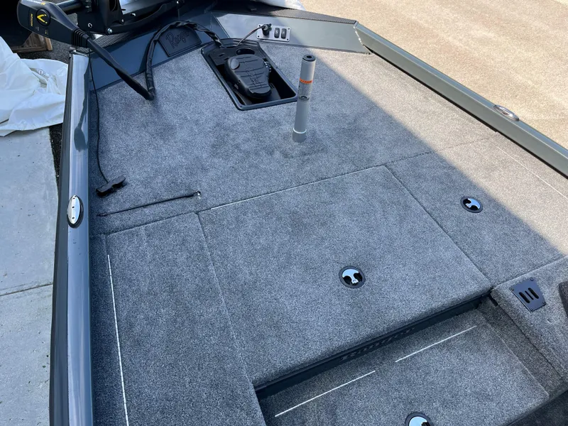 Slide: The Image of 2024 Ranger RT178 boat deck with gray carpet and storage compartments. - 3