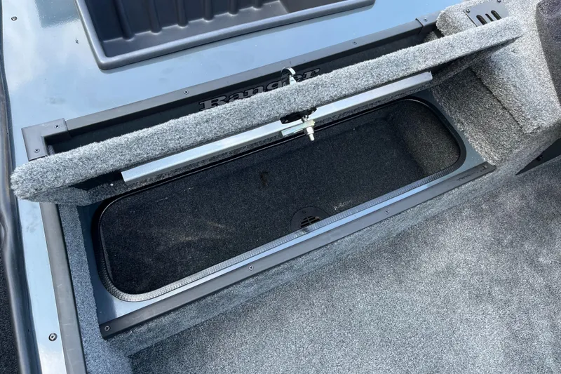 Slide: The Image of 2024 Ranger RT178 boat storage compartment with open lid. - 5
