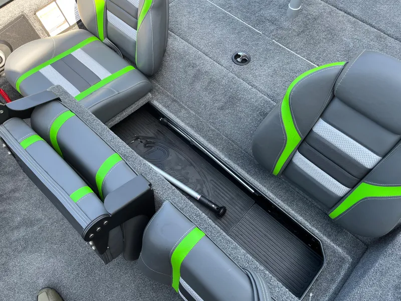 Slide: The Image of 2024 Ranger RT178 boat interior with gray and green seats and storage compartment. - 7