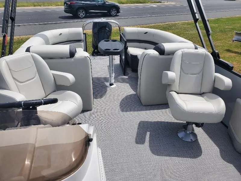 Slide: The Image of 2023 Starcraft EXS-5 boat interior with plush seating and modern design. - 2