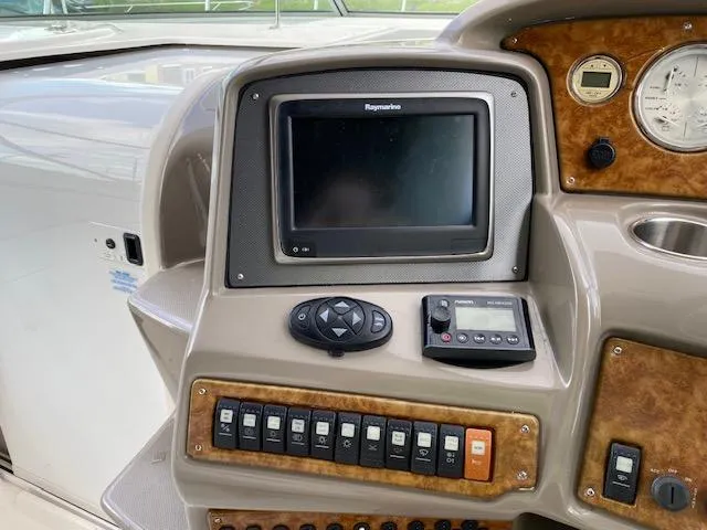 Slide: The Image of Control panel of a 2008 Rinker 350 Express Cruiser with Raymarine display. - 25