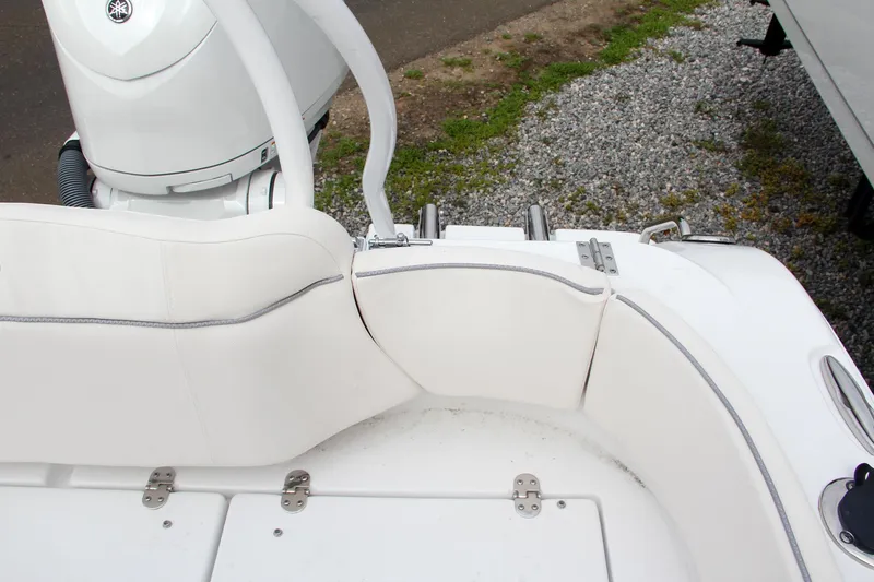 Slide: The Image of 2024 Sea Hunt Ultra 239 SE boat seating and engine area. - 15