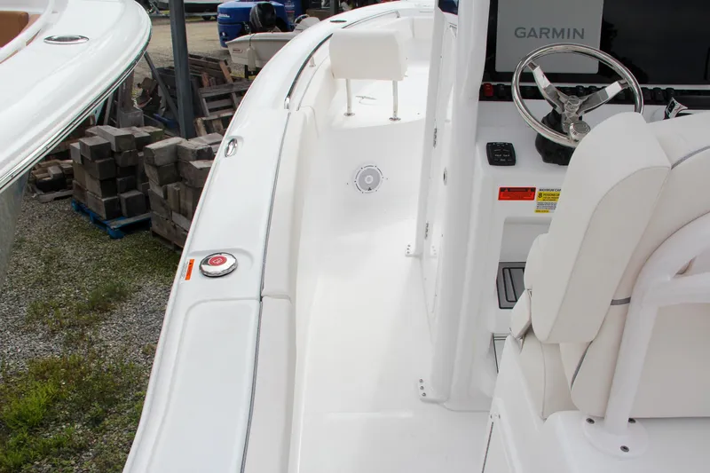 Slide: The Image of 2024 Sea Hunt Ultra 239 SE boat deck and helm station. - 16
