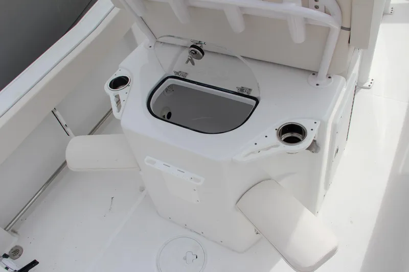 Slide: The Image of 2024 Sea Hunt Ultra 239 SE boat interior with livewell and rod holders. - 19