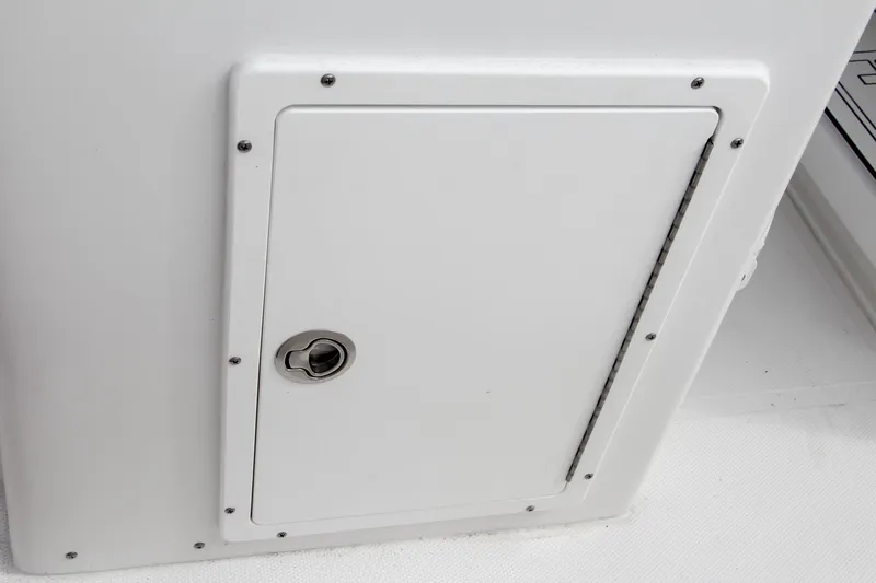 Slide: The Image of 2024 Sea Hunt Ultra 239 SE storage compartment with lock. - 23