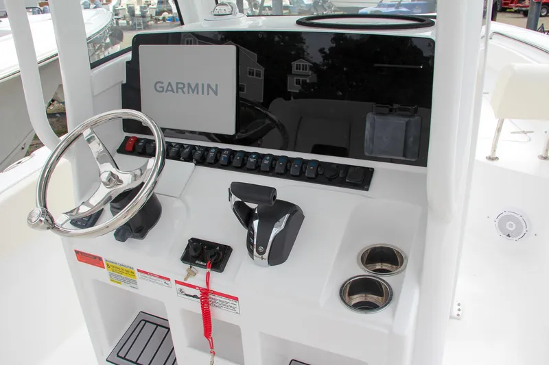 Slide: The Image of 2024 Sea Hunt Ultra 239 SE boat console with Garmin navigation system. - 29