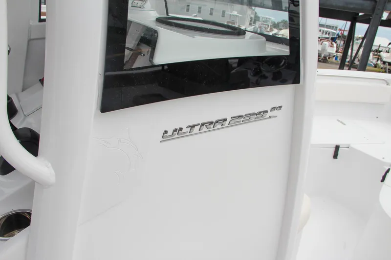 Slide: The Image of 2024 Sea Hunt Ultra 239 SE boat console with logo. - 34