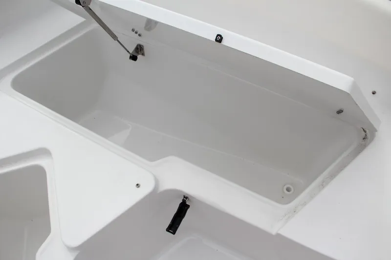 Slide: The Image of 2024 Sea Hunt Ultra 239 SE storage compartment. - 36