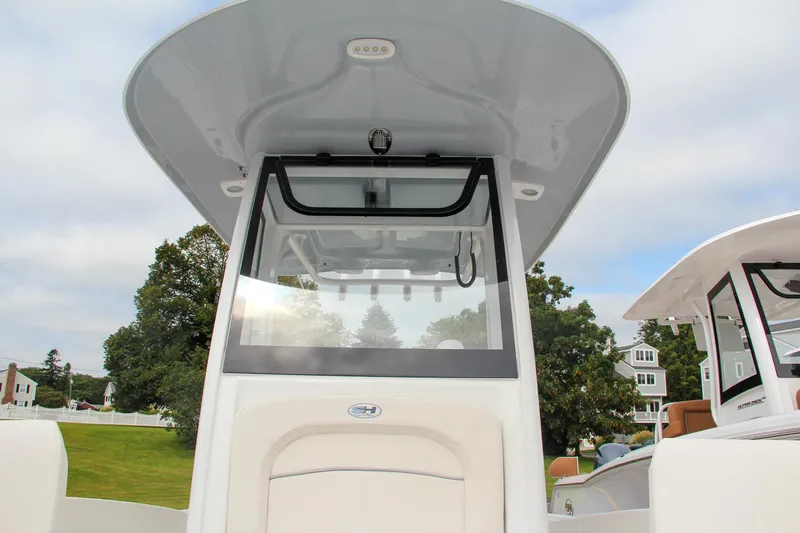 Slide: The Image of 2024 Sea Hunt Ultra 239 SE center console boat with T-top. - 38