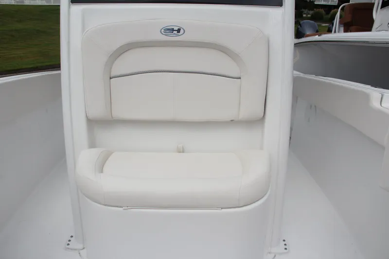 Slide: The Image of 2024 Sea Hunt Ultra 239 SE boat with white cushioned seating. - 39