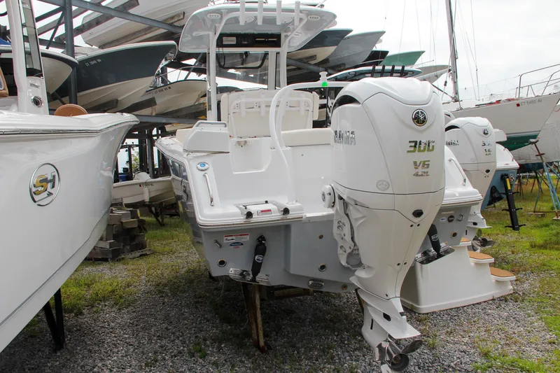 Slide: The Image of 2024 Sea Hunt Ultra 239 SE boat with Yamaha 300 V6 engine in storage. - 49