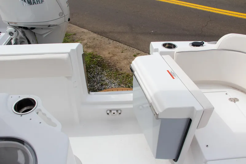 Slide: The Image of 2024 Sea Hunt Ultra 239 SE boat interior with seating and storage. - 5