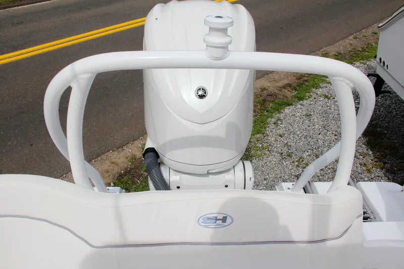 Slide: The Image of 2024 Sea Hunt Ultra 239 SE boat engine and rear seating. - 8