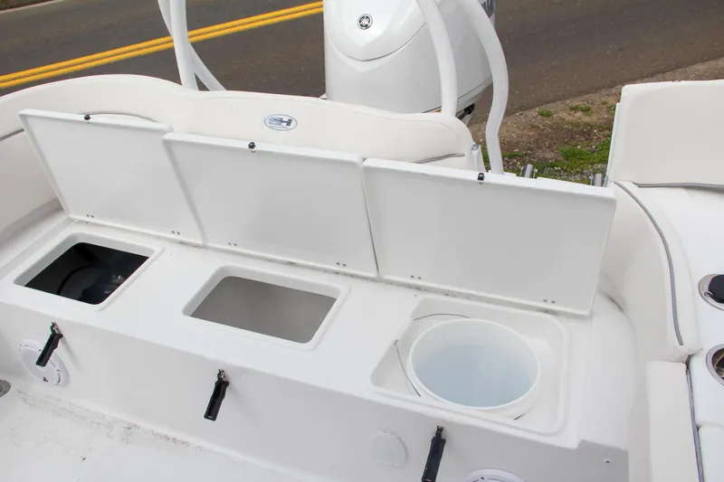 Slide: The Image of 2024 Sea Hunt Ultra 239 SE boat storage compartments and seating area. - 9