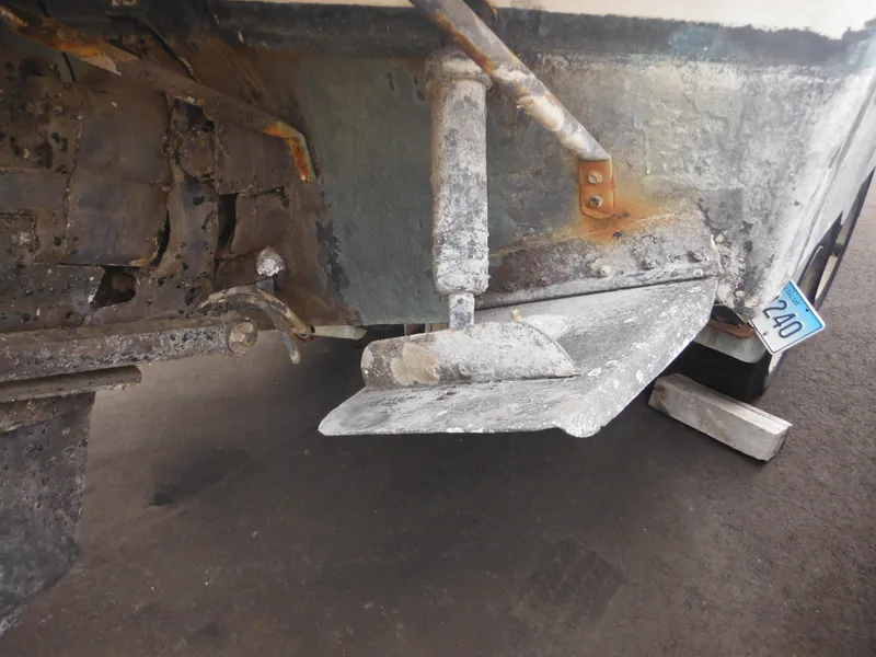 Slide: The Image of 1988 Sea Ray 268 Sundancer boat stern with visible wear and corrosion. - 11