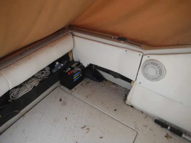Slide: The Image of Interior of 1988 Sea Ray 268 Sundancer boat with battery and storage area. - 19