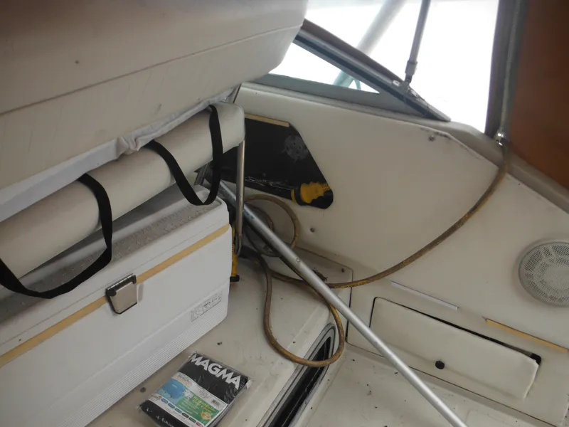 Slide: The Image of Interior of 1988 Sea Ray 268 Sundancer boat with cooler and Magma grill box. - 21