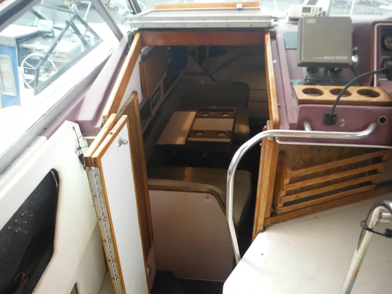 Slide: The Image of 1988 Sea Ray 268 Sundancer cabin interior with navigation equipment. - 22