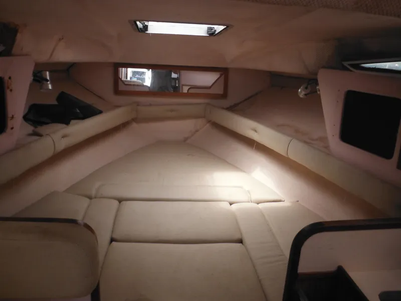 Slide: The Image of Interior cabin of 1988 Sea Ray 268 Sundancer boat with beige upholstery. - 26