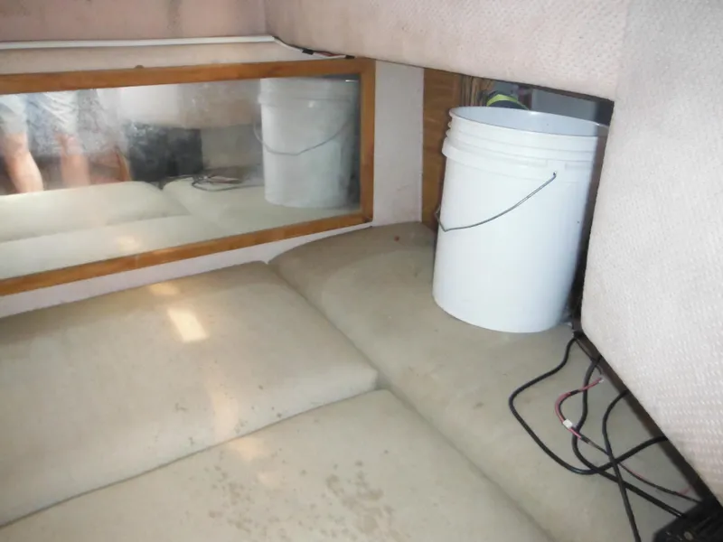 Slide: The Image of Interior of 1988 Sea Ray 268 Sundancer with bucket and mirror. - 29