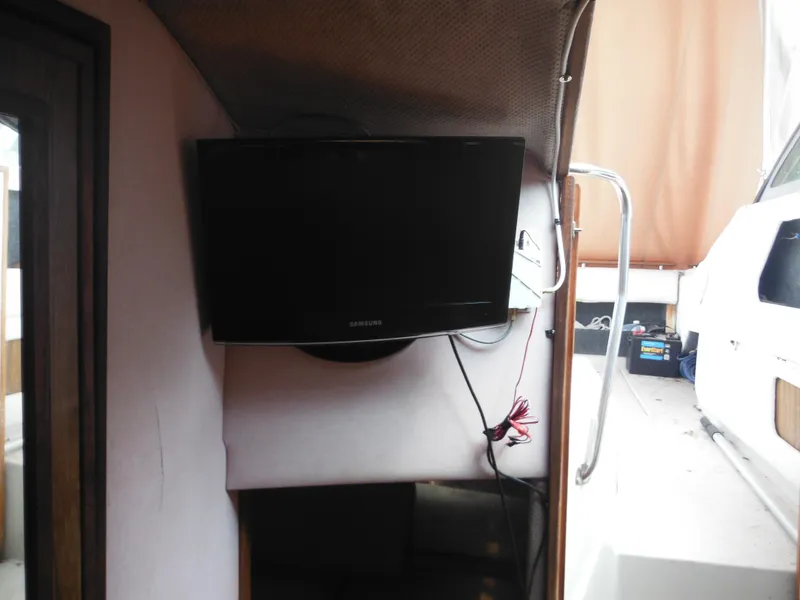 Slide: The Image of Flat-screen TV inside 1988 Sea Ray 268 Sundancer boat cabin. - 32