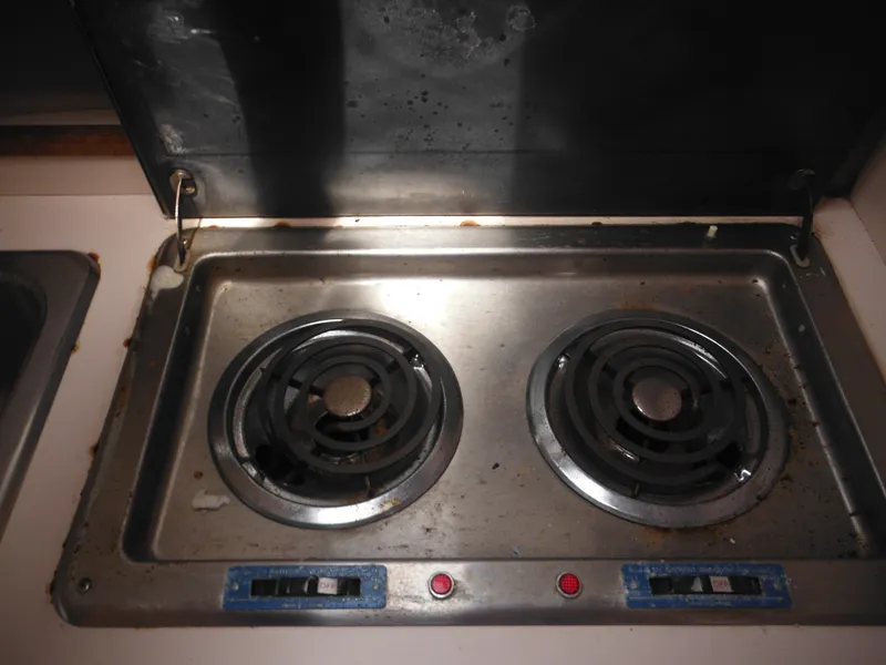 Slide: The Image of 1988 Sea Ray 268 Sundancer stove with two electric burners. - 34