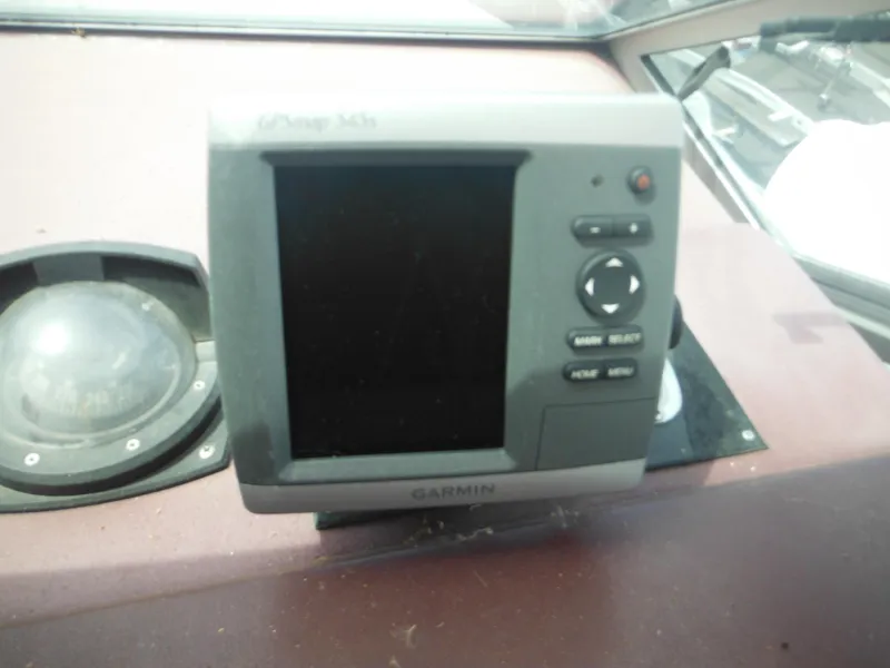 Slide: The Image of Garmin GPS device on 1988 Sea Ray 268 Sundancer boat dashboard. - 38