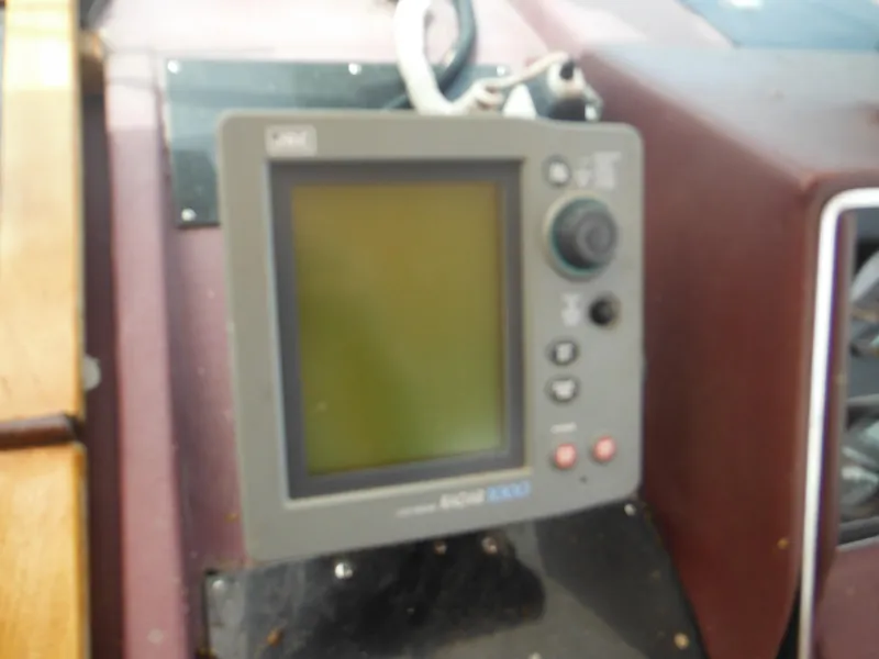 Slide: The Image of Close-up of navigation equipment on a 1988 Sea Ray 268 Sundancer boat. - 39