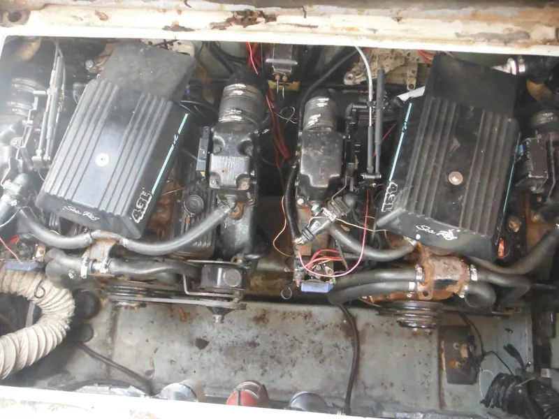 Slide: The Image of 1988 Sea Ray 268 Sundancer engine compartment with twin engines. - 41