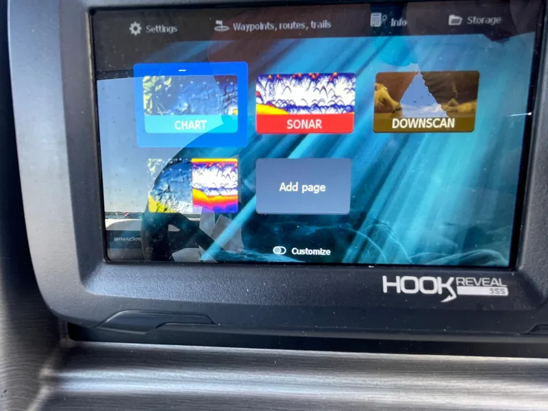 Slide: The Image of Fishfinder display on a 2023 Berkshire 24 UL CTS boat showing chart, sonar, and downscan options. - 12