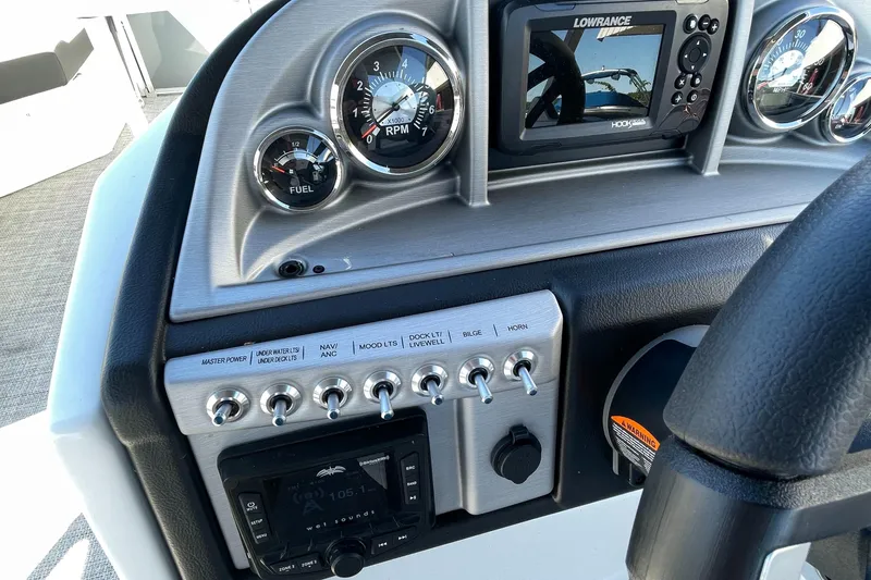 Slide: The Image of Control panel of 2023 Berkshire 24 UL CTS boat with gauges and navigation system. - 15