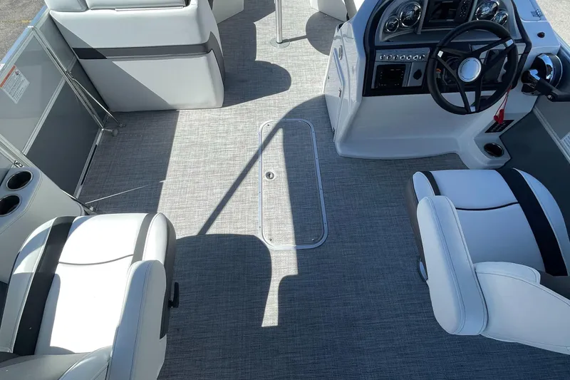 Slide: The Image of 2023 Berkshire 24 UL CTS boat interior with helm and seating. - 20