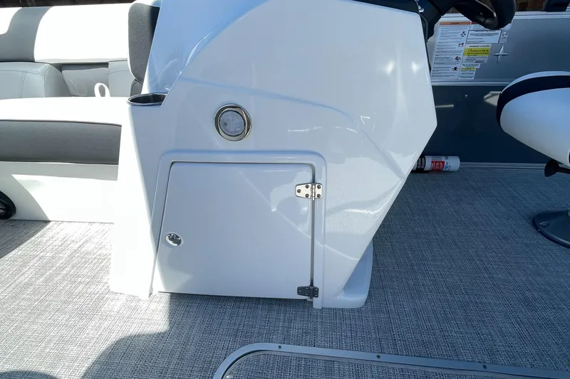 Slide: The Image of 2023 Berkshire 24 UL CTS boat interior with storage compartment and seating. - 23