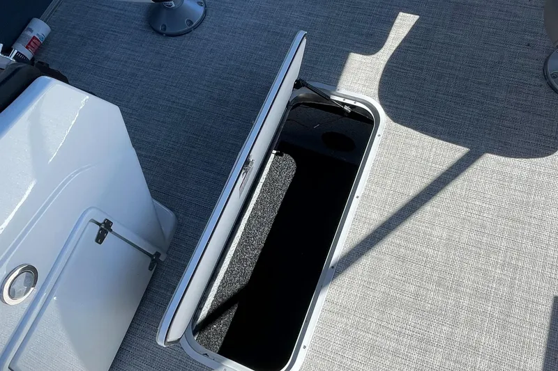 Slide: The Image of Open storage compartment on 2023 Berkshire 24 UL CTS boat. - 27